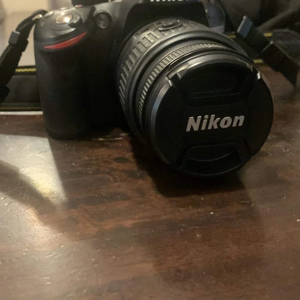 Nikon D3200. 2 lenses. Charger. Camera bag. Pretty much brand new.